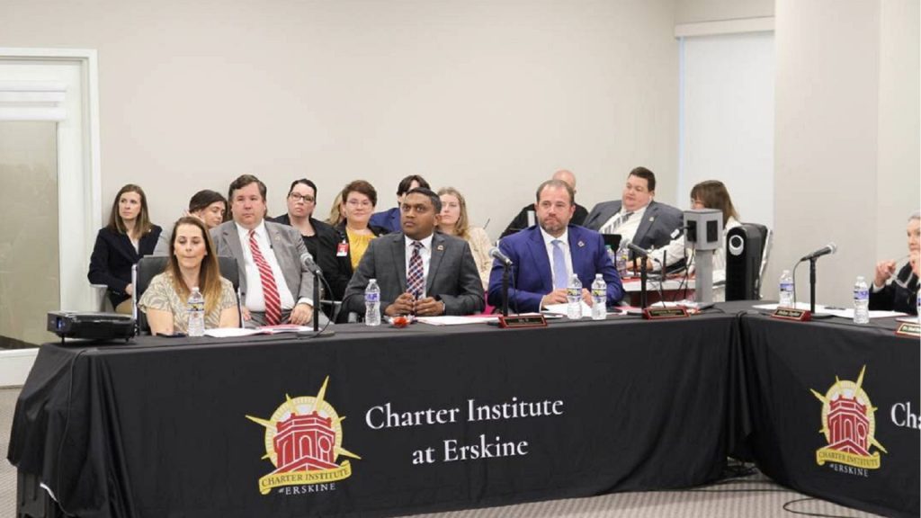 Charter Institute at Erskine CEO and Superintendent Cameron Runyan front right listens to presentations by charter school applicants on April 17 2024